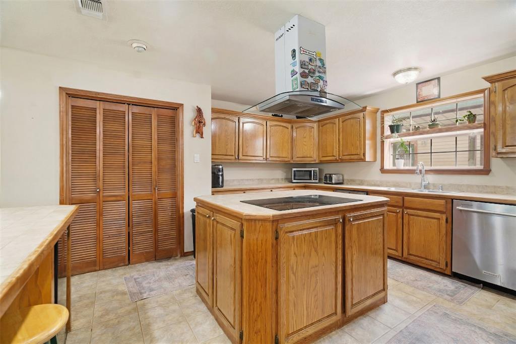 3178 East 2150 Road Grant, OK 74738 - Photo 6 of 40 a kitchen with a stove a sink and a refrigerator