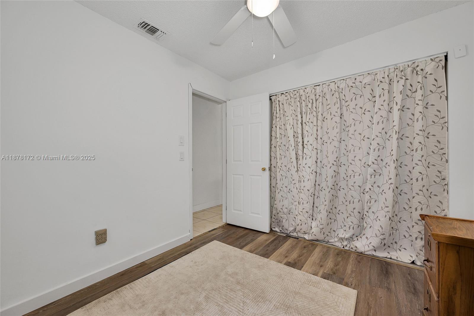 1720 Southwest 84th Avenue Miramar, FL 33025 - Photo 12 of 30 an empty room with wooden floor and windows