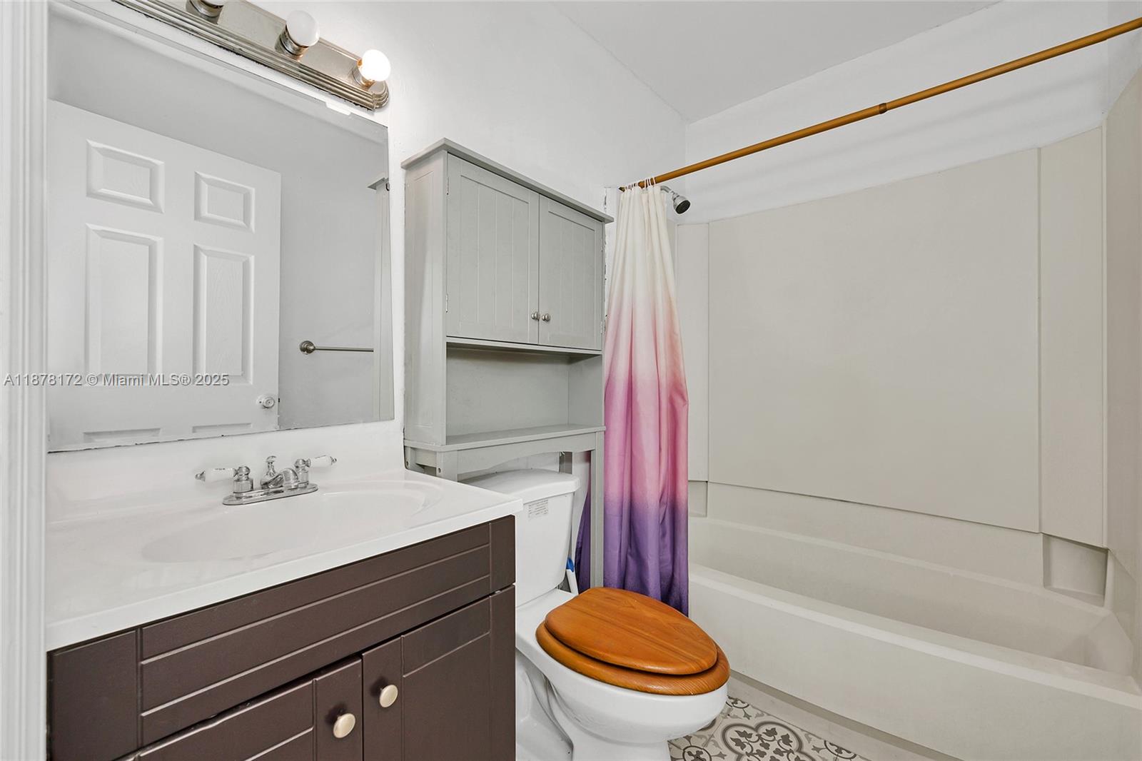 1720 Southwest 84th Avenue Miramar, FL 33025 - Photo 14 of 30 a bathroom with a sink a toilet and a bathtub