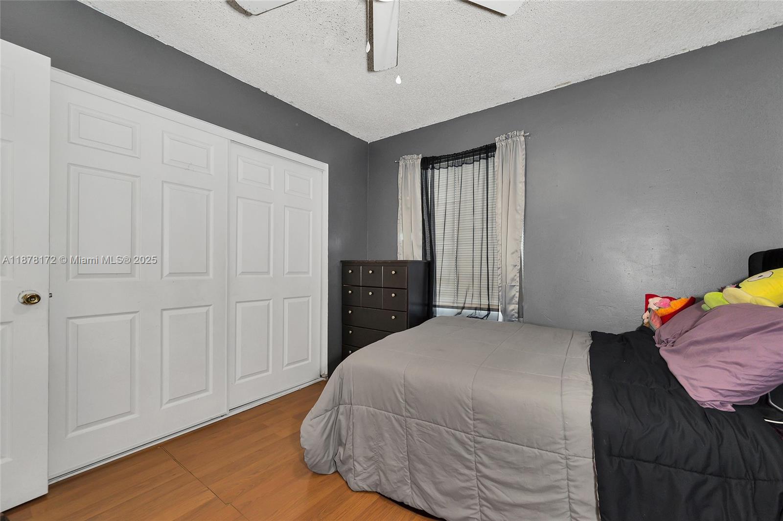 1720 Southwest 84th Avenue Miramar, FL 33025 - Photo 17 of 30 a bedroom with a bed and a closet