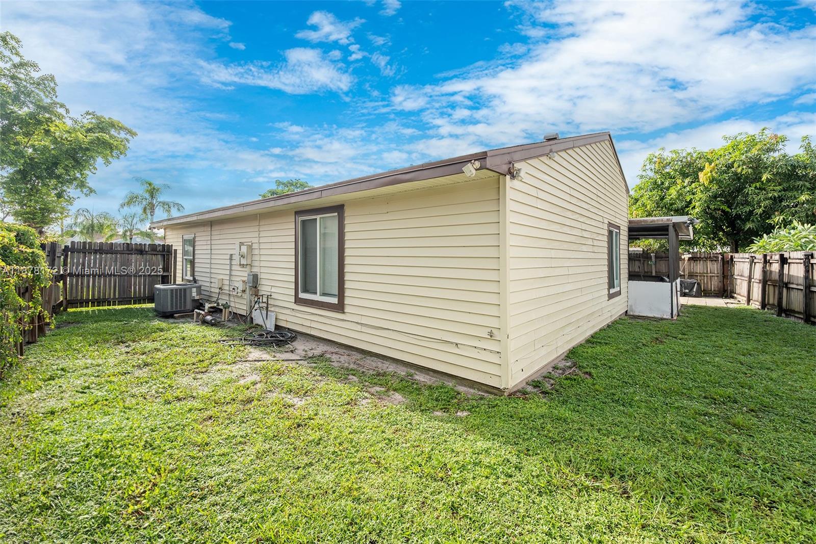 1720 Southwest 84th Avenue Miramar, FL 33025 - Photo 25 of 30 a view of a backyard with a garden