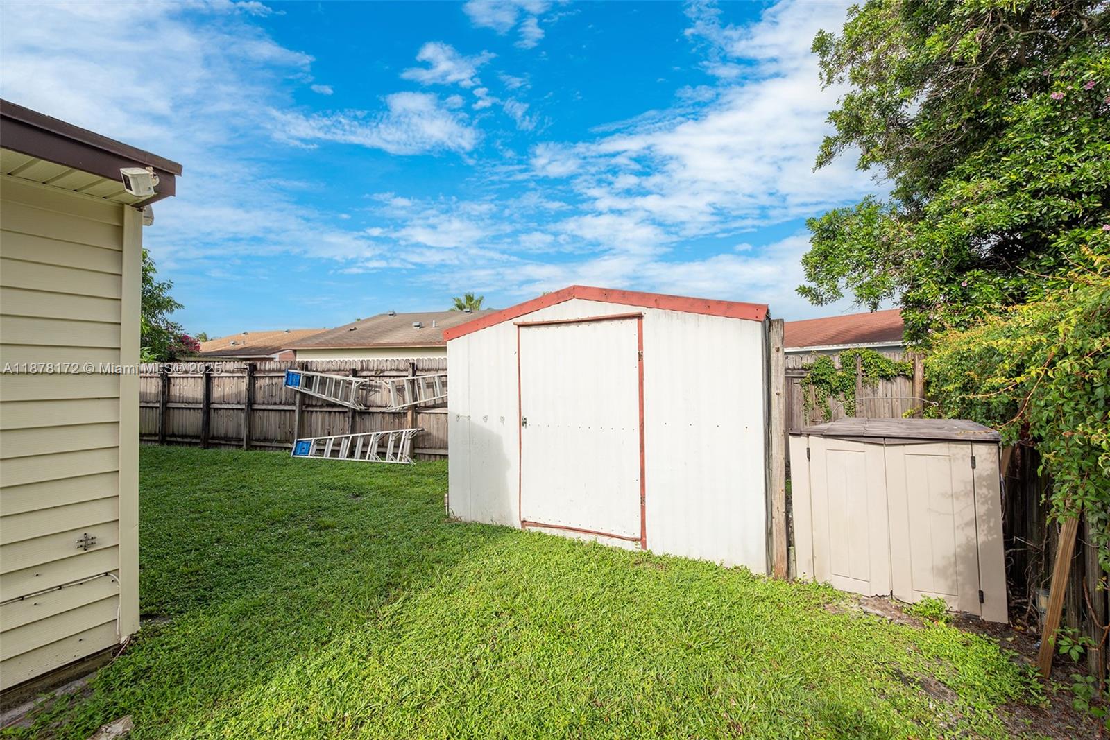 1720 Southwest 84th Avenue Miramar, FL 33025 - Photo 26 of 30 a backyard of a house with lots of green space