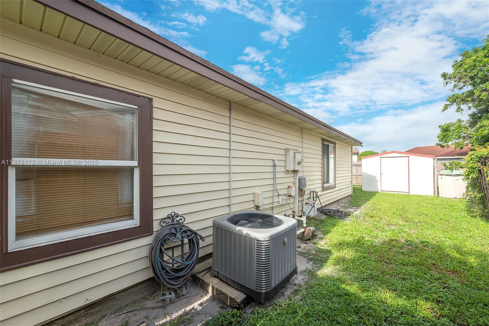 1720 Southwest 84th Avenue Miramar, FL 33025 - Photo 27 of 30 a backyard of a house with table and chairs