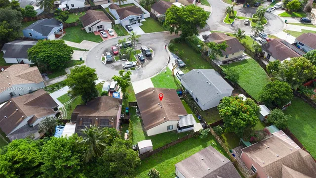 an aerial view of a house with a garden