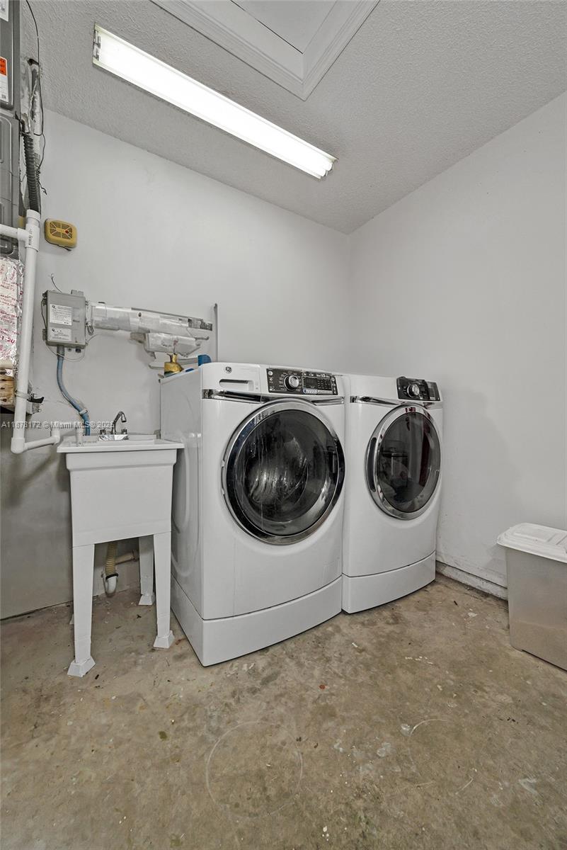 1720 Southwest 84th Avenue Miramar, FL 33025 - Photo 10 of 30 a utility room with dryer and washer