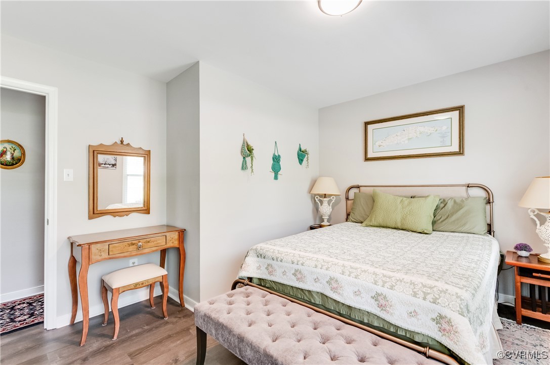 7111 Ledo Road Moseley, VA 23120 - Photo 17 of 47 a bedroom with a bed and a chair