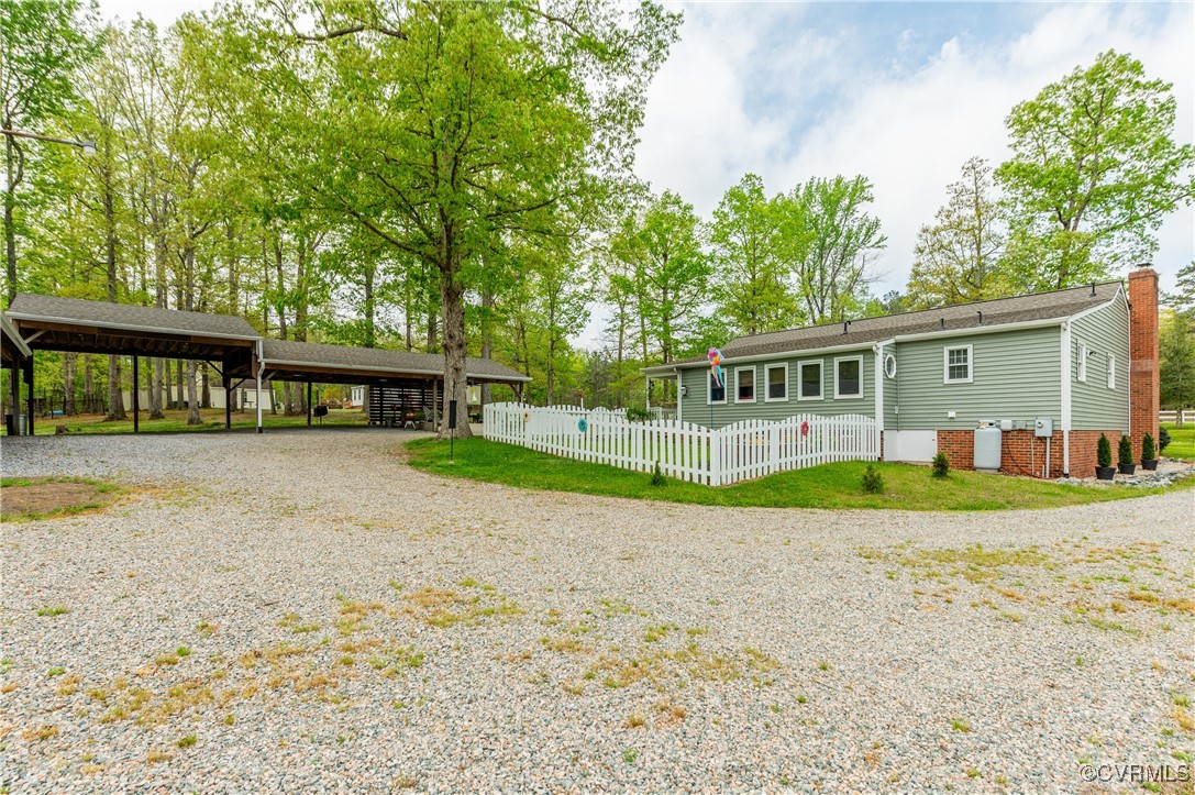 7111 Ledo Road Moseley, VA 23120 - Photo 25 of 47 front view of a house with a yard
