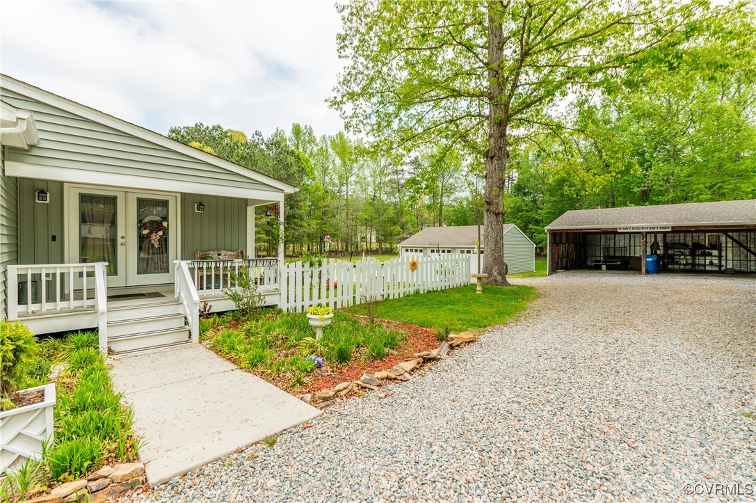 7111 Ledo Road Moseley, VA 23120 - Photo 33 of 47 a front view of a house with a yard table and chairs