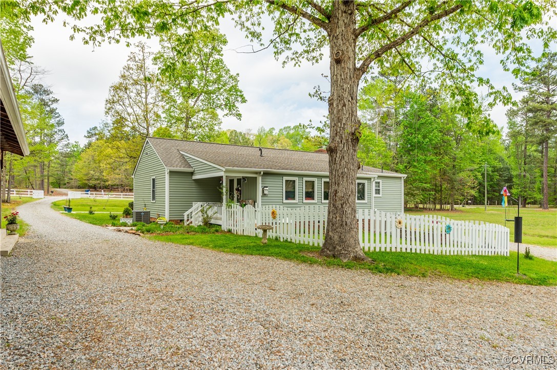 7111 Ledo Road Moseley, VA 23120 - Photo 34 of 47 a view of a house with a yard and large trees