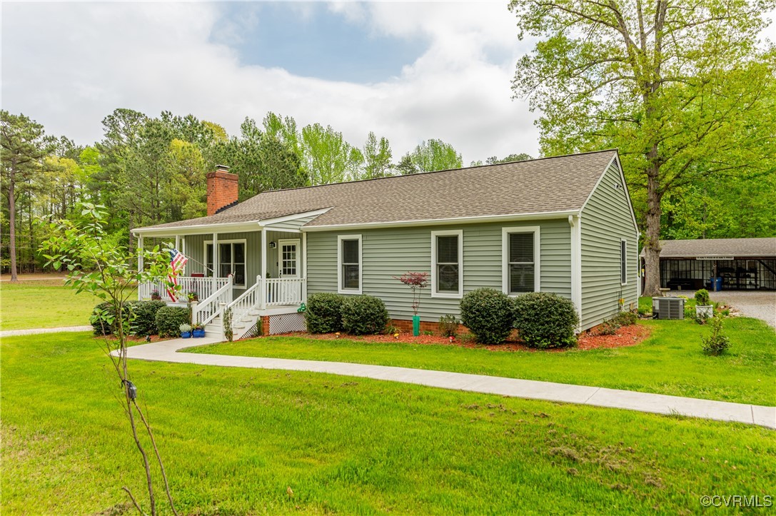 7111 Ledo Road Moseley, VA 23120 - Photo 44 of 47 a front view of house with yard and green space