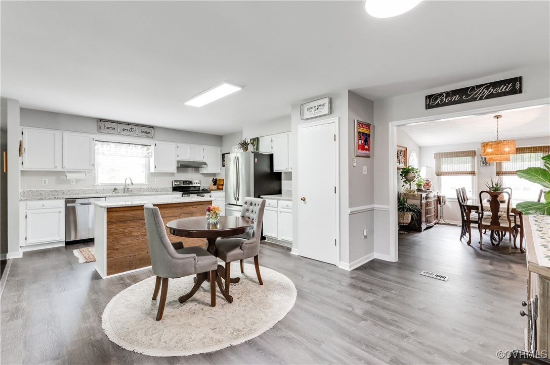 7111 Ledo Road Moseley, VA 23120 - Photo 9 of 47 a dining room with furniture and wooden floor