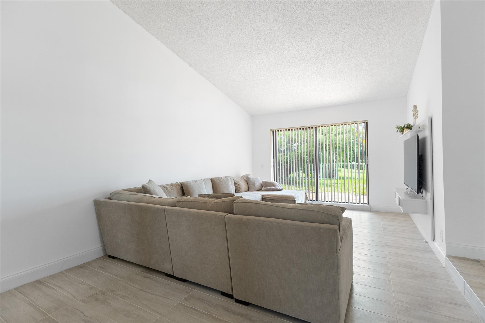 9477 Burlington Place Boca Raton, FL 33434 - Photo 11 of 40 a living room with furniture and a large window