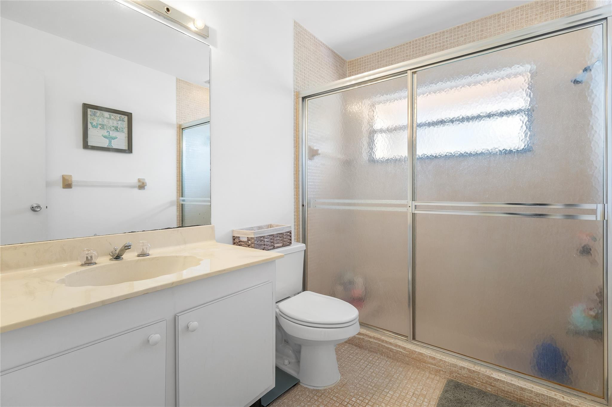 9477 Burlington Place Boca Raton, FL 33434 - Photo 15 of 40 a bathroom with a sink a toilet and shower