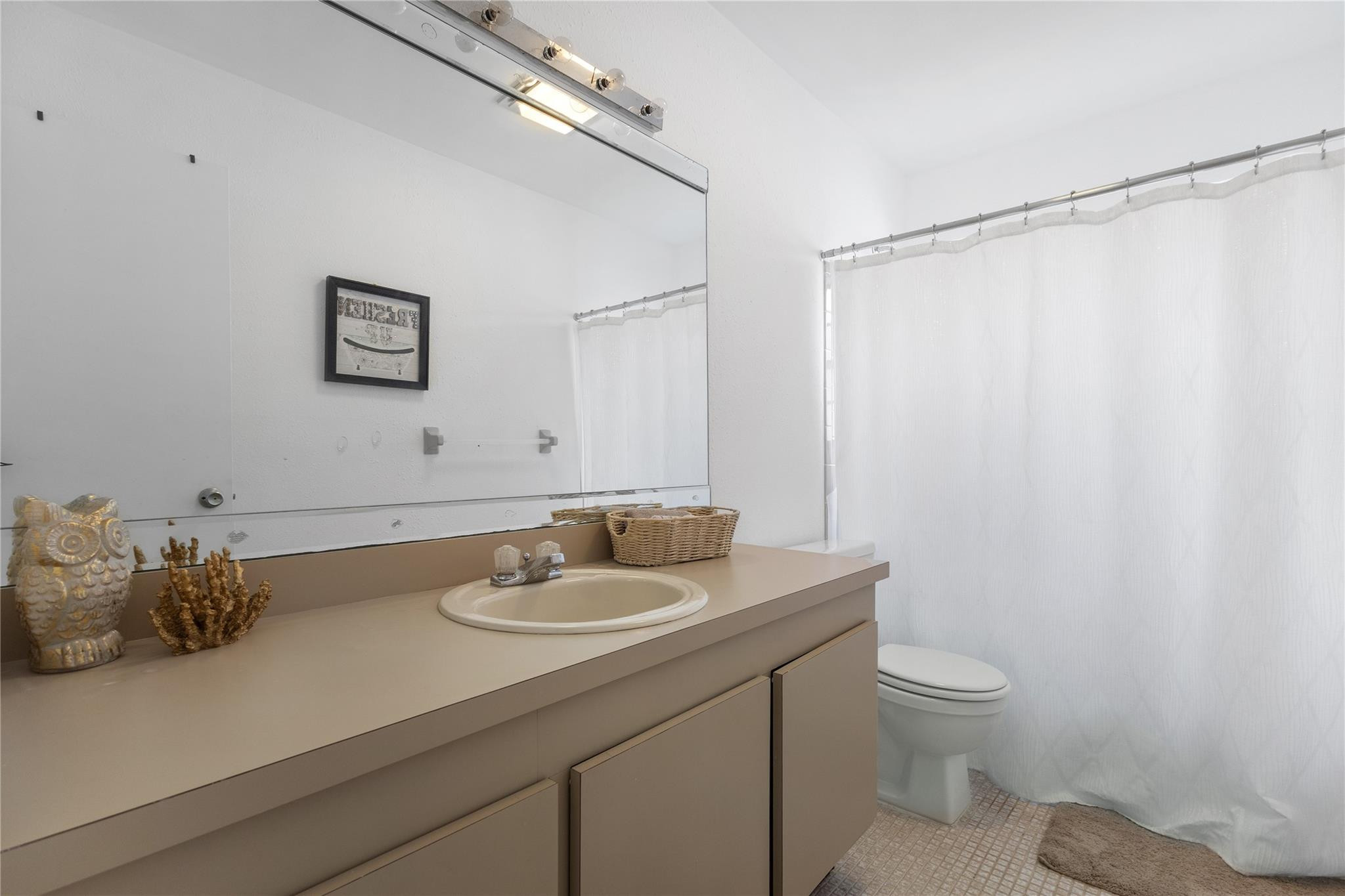 9477 Burlington Place Boca Raton, FL 33434 - Photo 18 of 40 a bathroom with a sink toilet and vanity