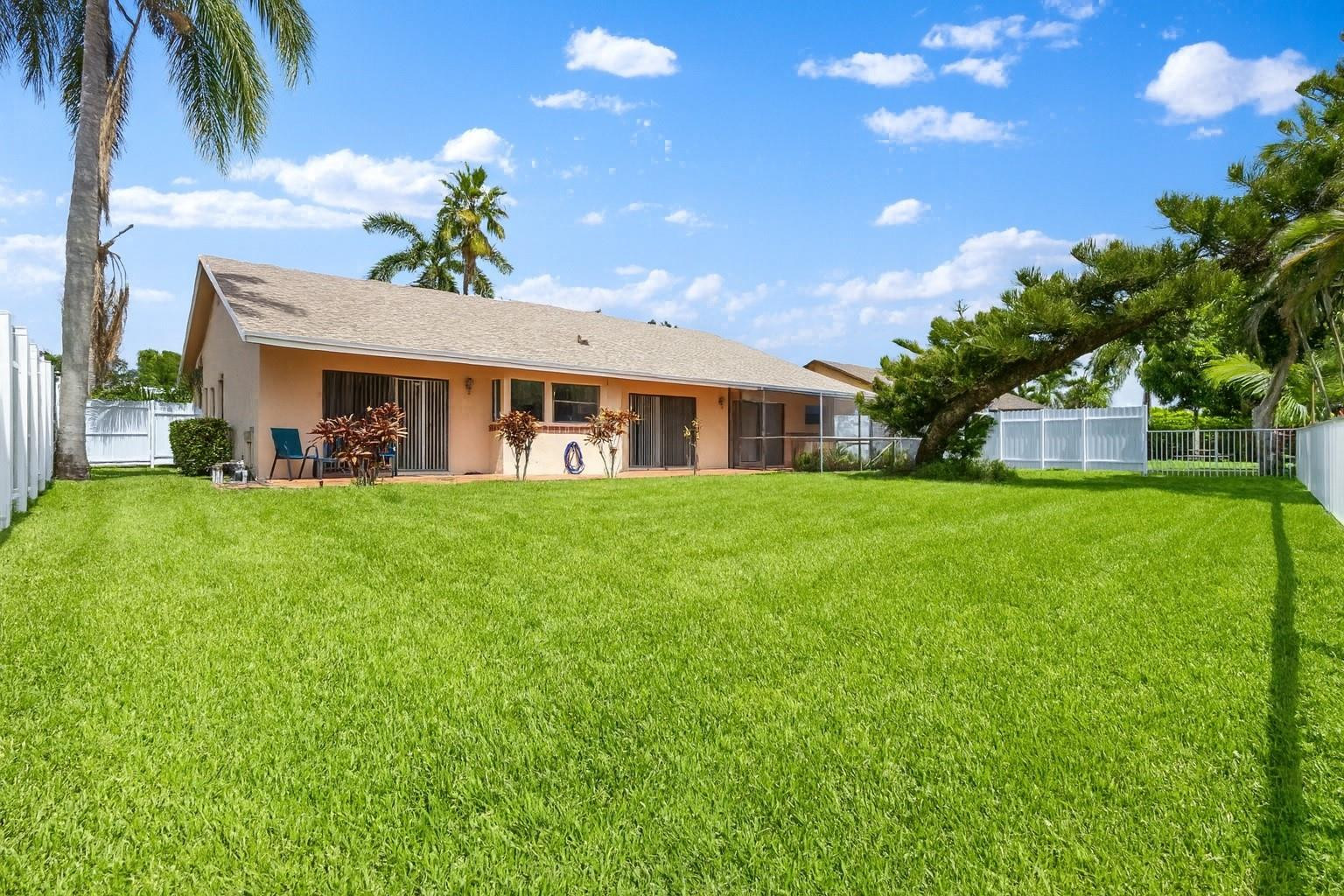 9477 Burlington Place Boca Raton, FL 33434 - Photo 23 of 40 a front view of house with yard