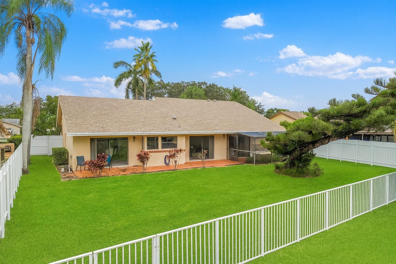 9477 Burlington Place Boca Raton, FL 33434 - Photo 24 of 40 a view of a house with a yard porch and sitting area
