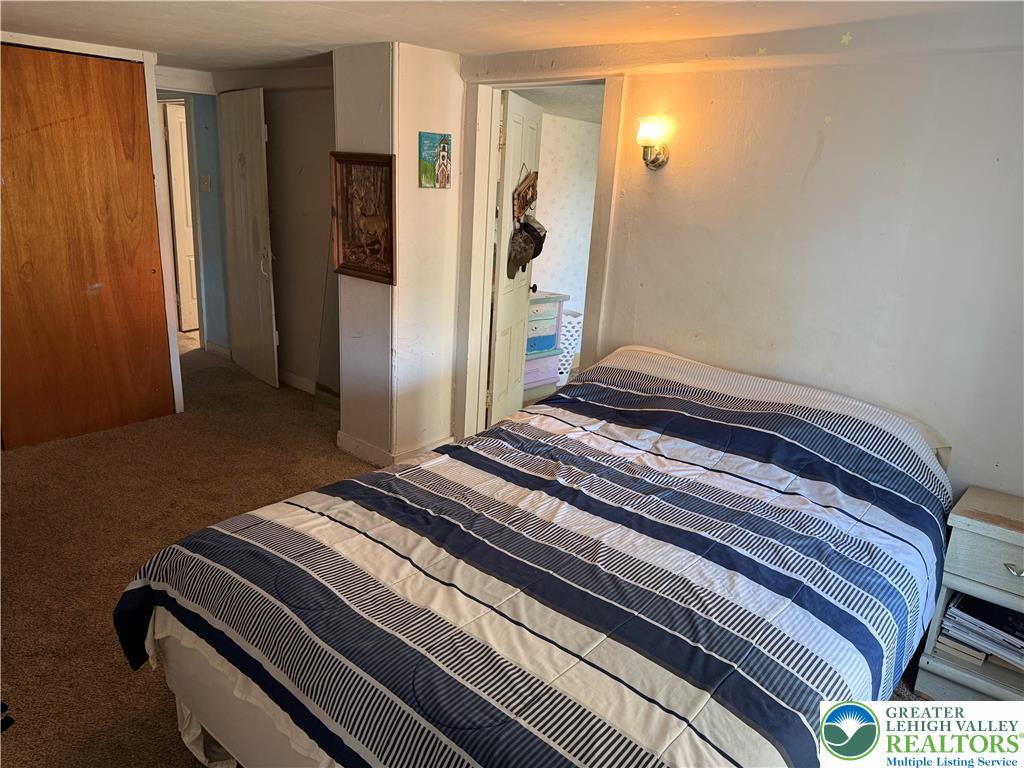 1227 Valley Road Tamaqua, PA 18252 - Photo 28 of 47 a bedroom with a bed and a window