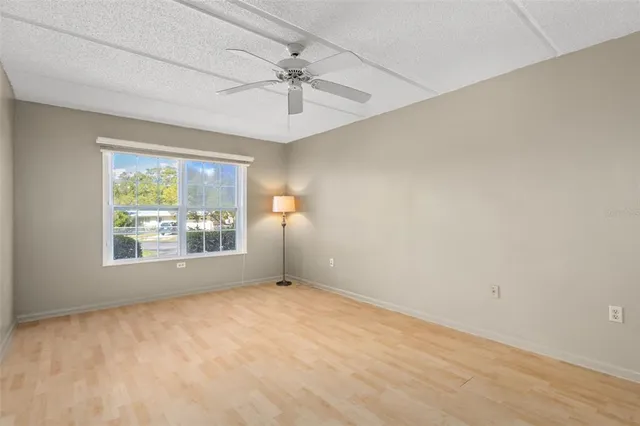 a view of a big room with closet and fan