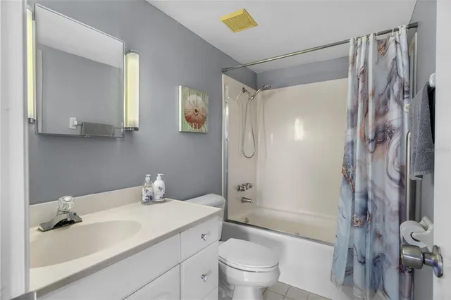 a balcony with table and chairs