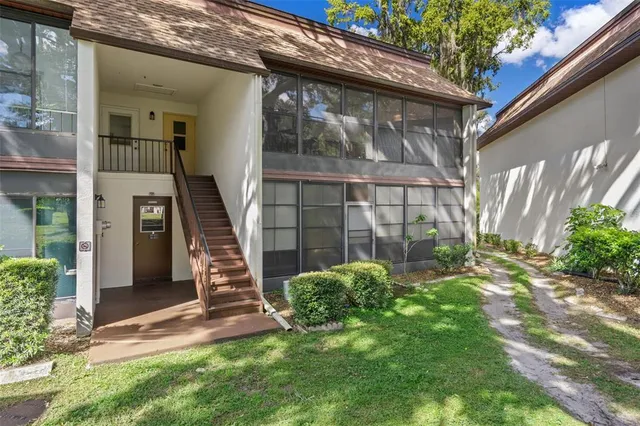 a aerial view of a house with a yard