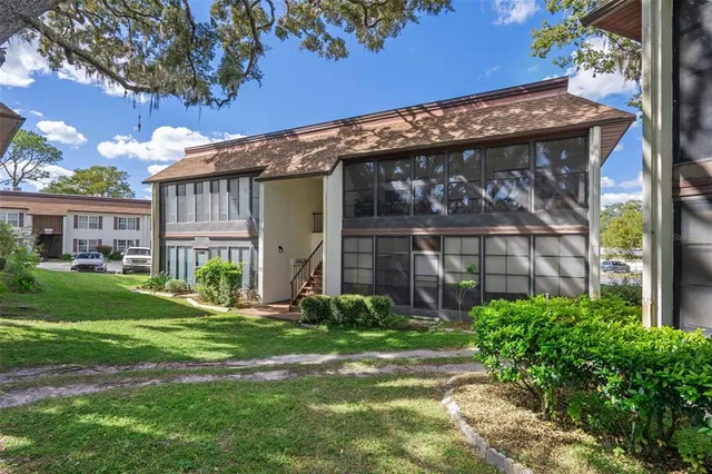 a backyard of a house with lots of green space