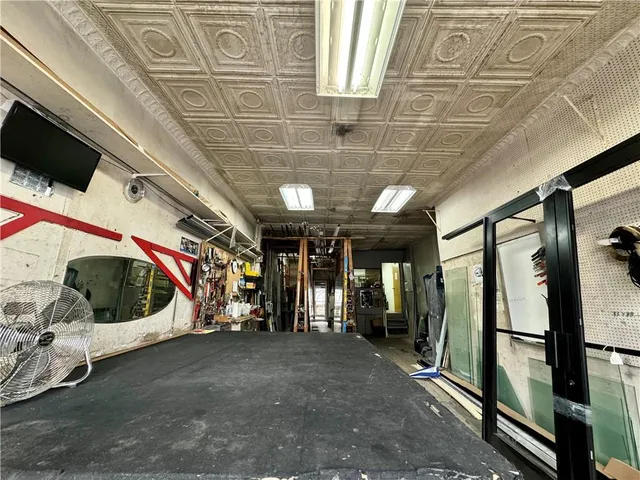 a view of a patio with a table and chairs