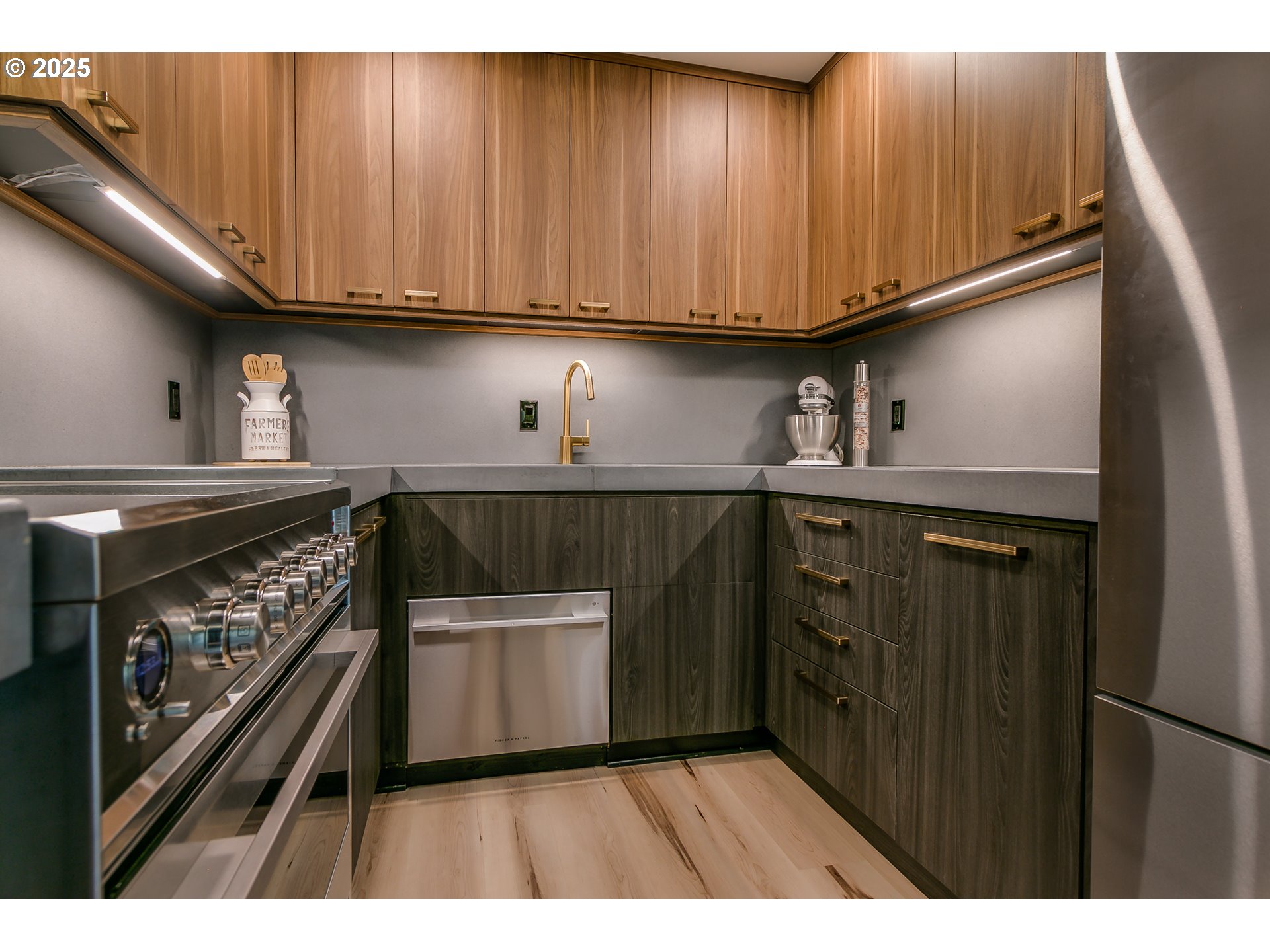 110 High Street Eugene, OR 97401 - Photo 14 of 46 a kitchen with wooden cabinets and a stove top oven