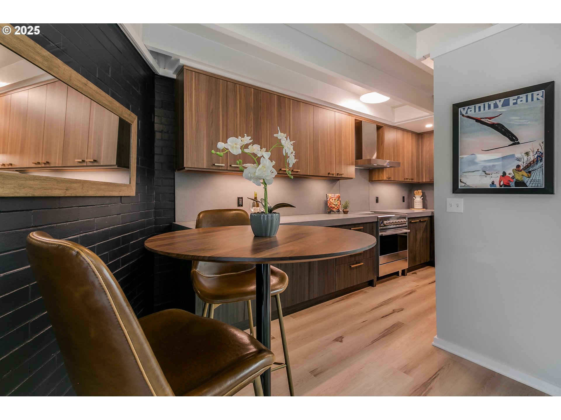 110 High Street Eugene, OR 97401 - Photo 8 of 46 a kitchen with stainless steel appliances kitchen island granite countertop a sink a stove a dining table and chairs