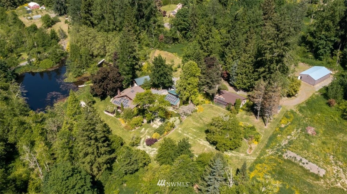 4214 Linnell Road Deming, WA 98244 - Photo 1 of 40 a backyard of a house with lots of trees