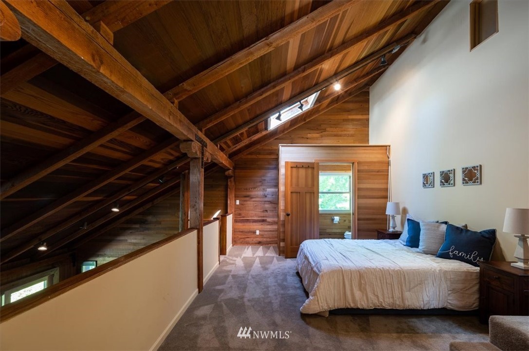 4214 Linnell Road Deming, WA 98244 - Photo 11 of 40 a bedroom with a large bed and furniture