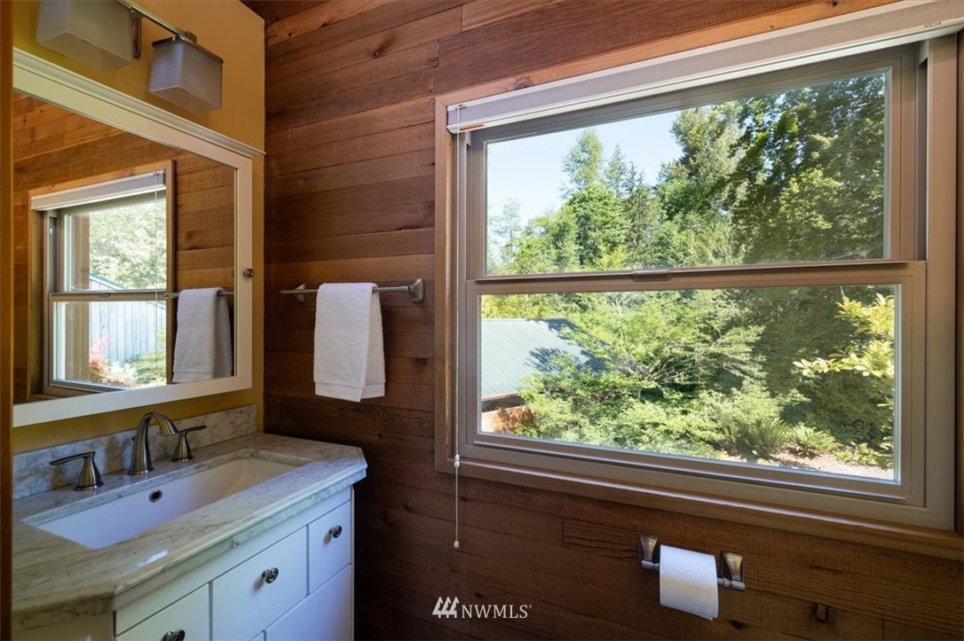 4214 Linnell Road Deming, WA 98244 - Photo 12 of 40 a bathroom with a sink mirror and a window