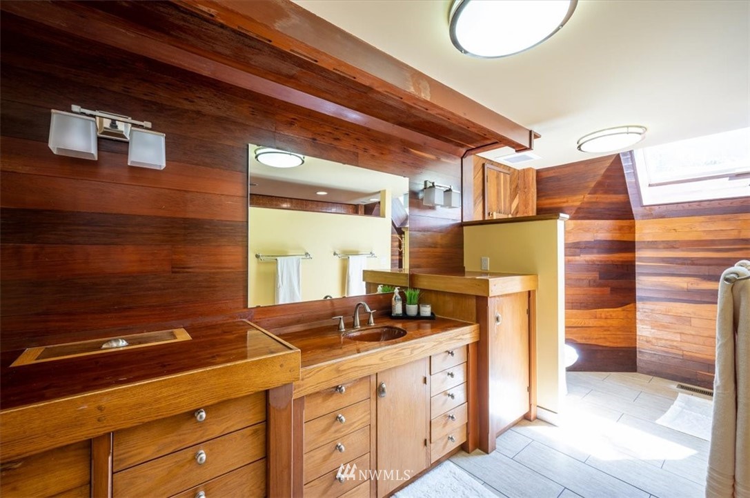 4214 Linnell Road Deming, WA 98244 - Photo 15 of 40 a bathroom with a sink and a mirror