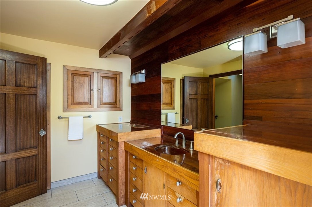 4214 Linnell Road Deming, WA 98244 - Photo 17 of 40 a bathroom with a sink and a mirror