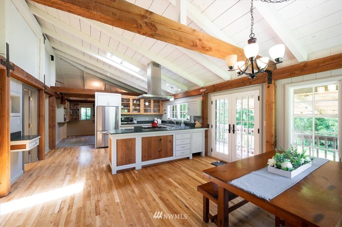 4214 Linnell Road Deming, WA 98244 - Photo 28 of 40 a open kitchen with a table and chairs in it