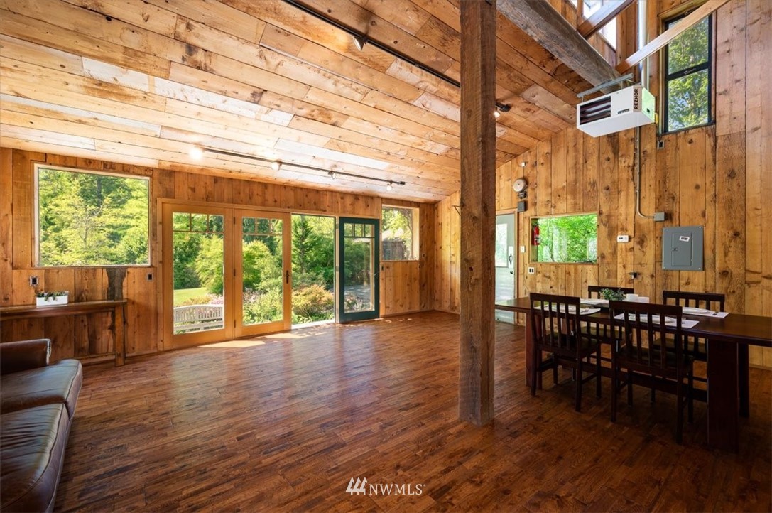 4214 Linnell Road Deming, WA 98244 - Photo 33 of 40 a view of a dining room with furniture window and wooden floor