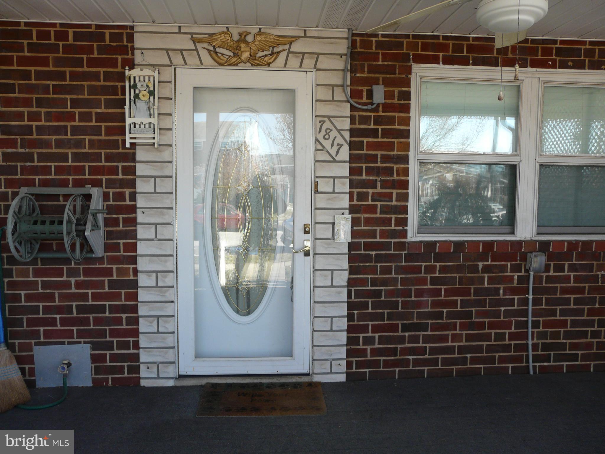 7817 Jamesford Road Baltimore, MD 21222 - Photo 3 of 29 a view of a door of a brick building