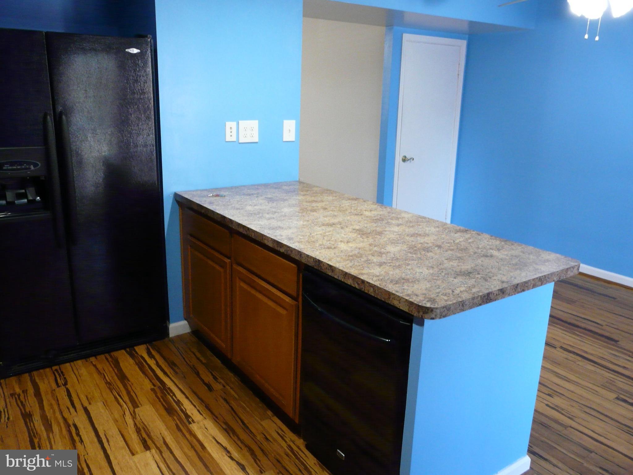 7817 Jamesford Road Baltimore, MD 21222 - Photo 8 of 29 a kitchen with a sink and cabinets