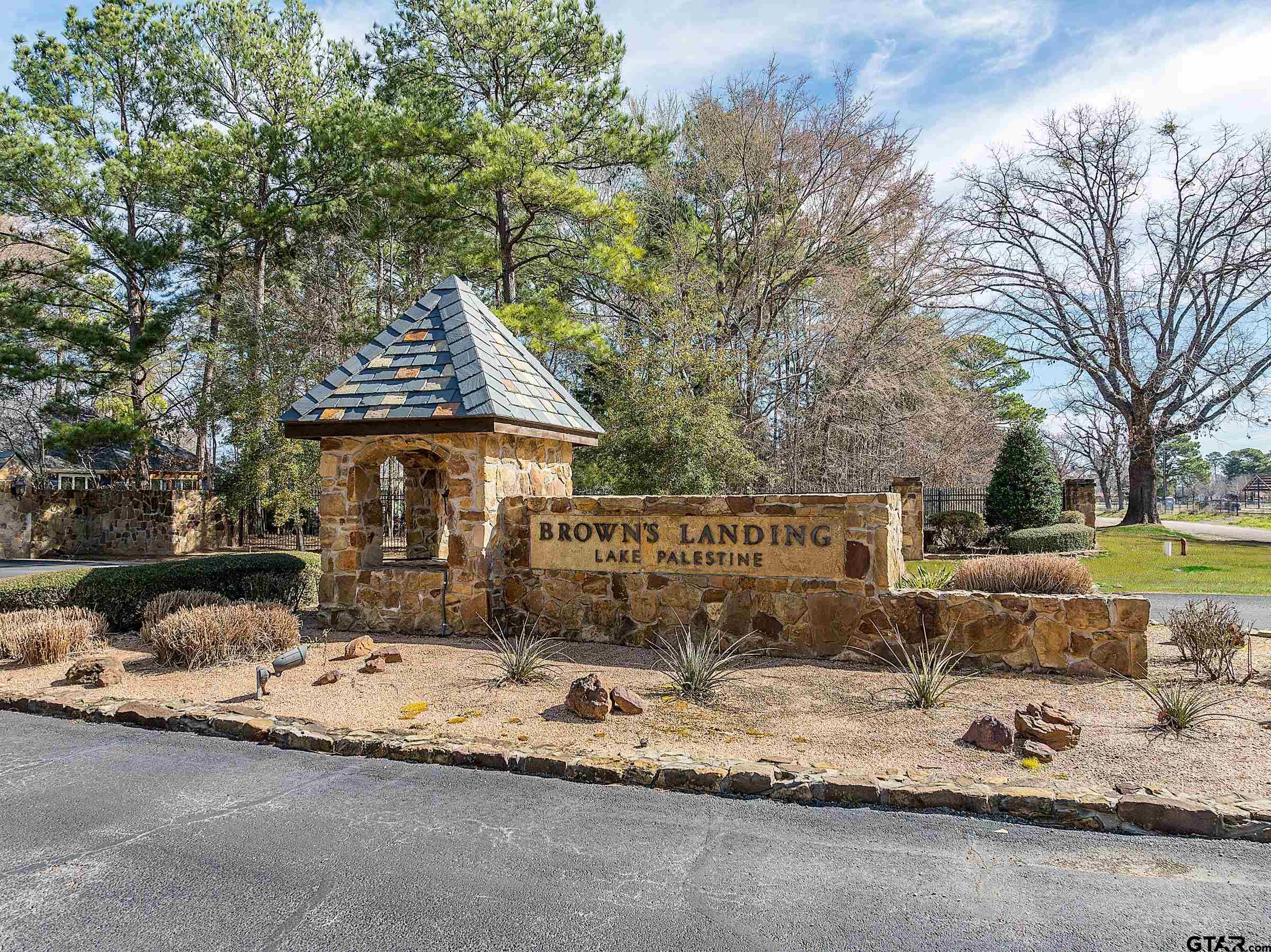 5670 Nathan Drive Chandler, TX 75758 - Photo 16 of 18 a front view of a house with a yard covered with trees