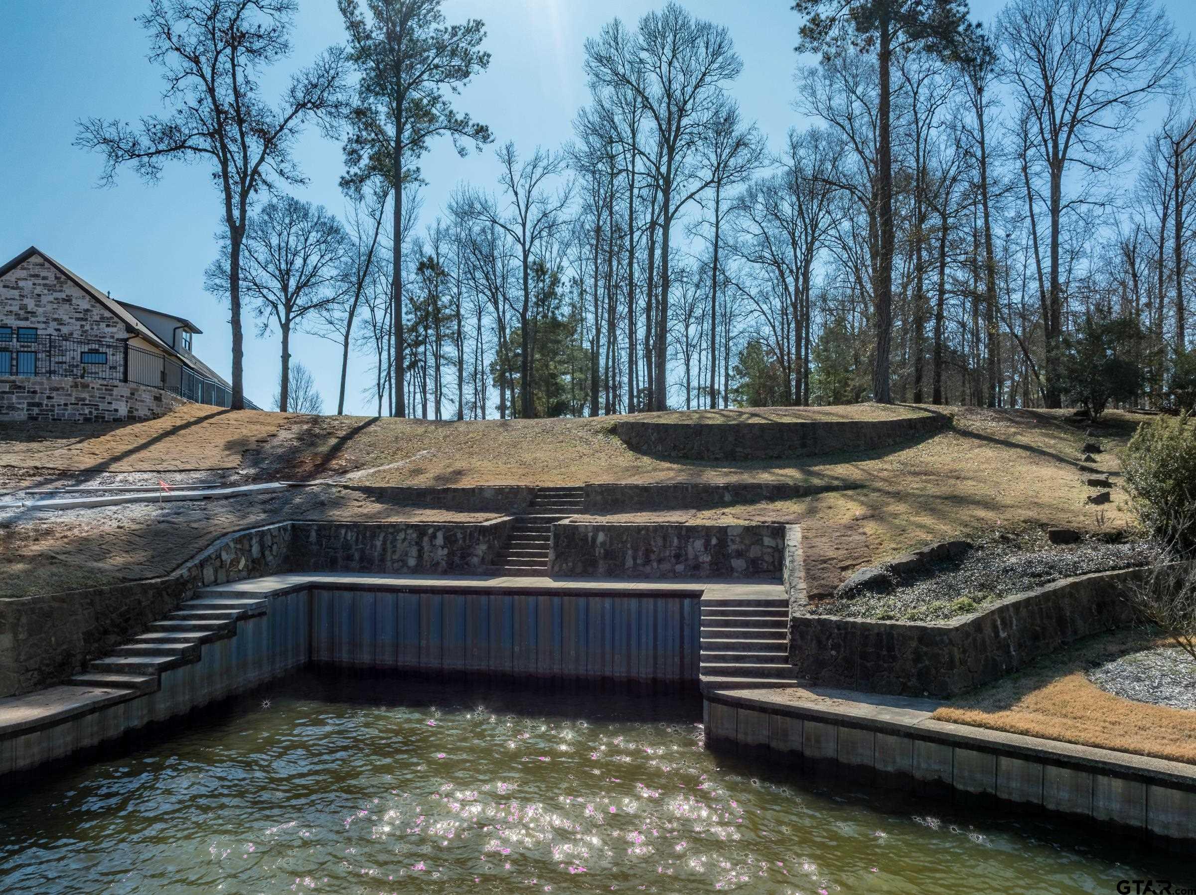 5670 Nathan Drive Chandler, TX 75758 - Photo 3 of 18 a view of a backyard with trees