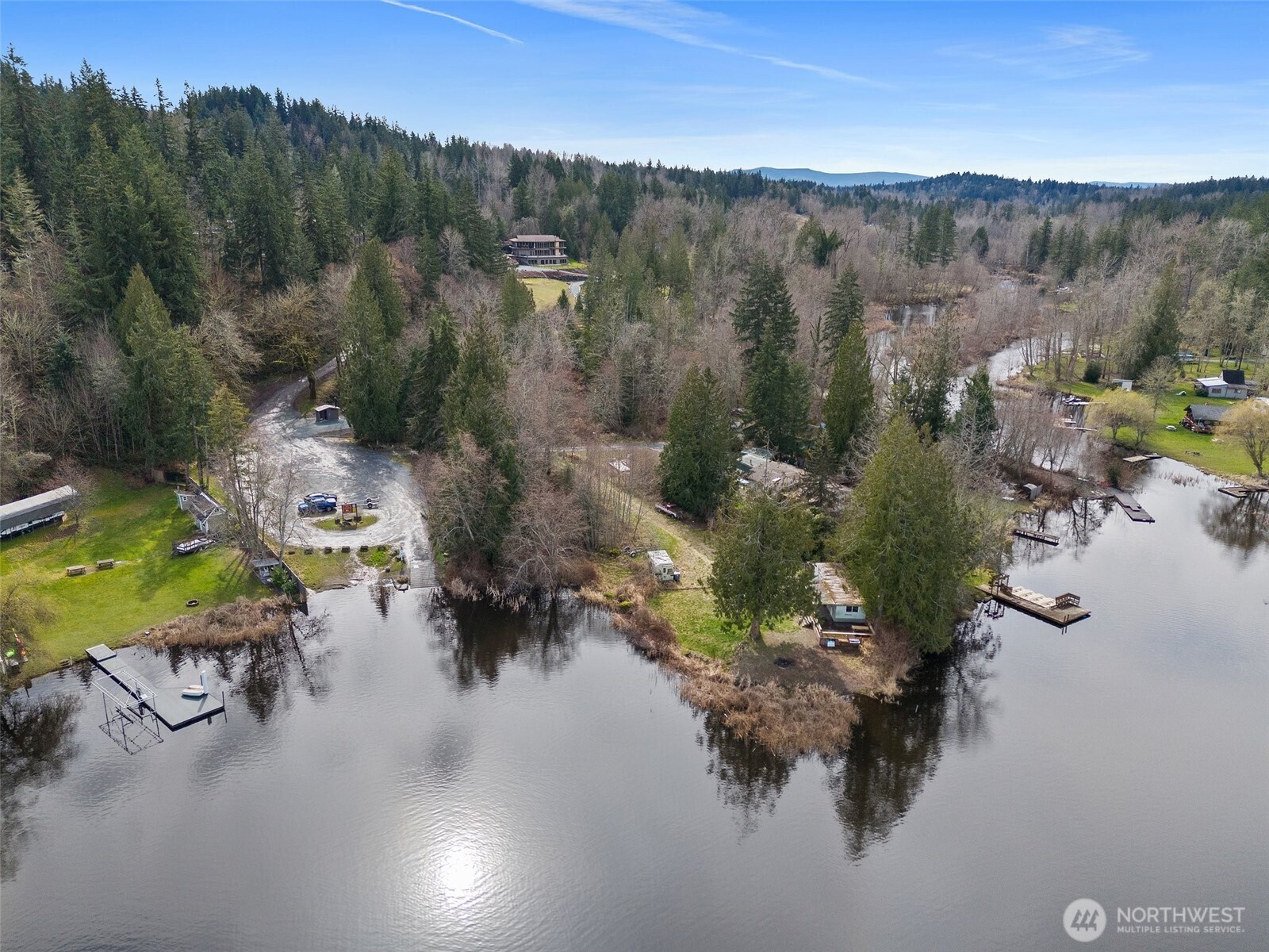 an aerial view of a swimming pool with a yard
