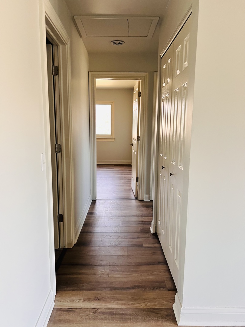 575 Greystone Lane, Unit A2 Wheeling, IL 60090 - Photo 11 of 13 a view of a hallway with wooden floor