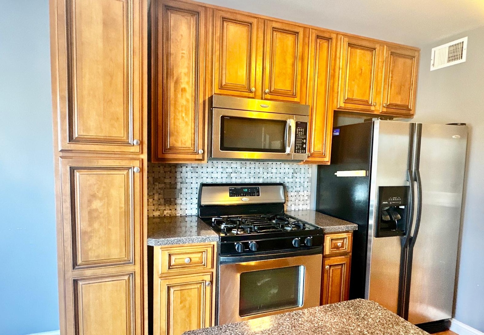 575 Greystone Lane, Unit A2 Wheeling, IL 60090 - Photo 4 of 13 a kitchen with windows and refrigerator