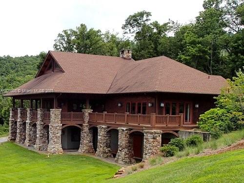 25 Fates Overlook Loop, Unit 103 Black Mountain, NC 28711 - Photo 11 of 21 a view of house with yard and sitting area
