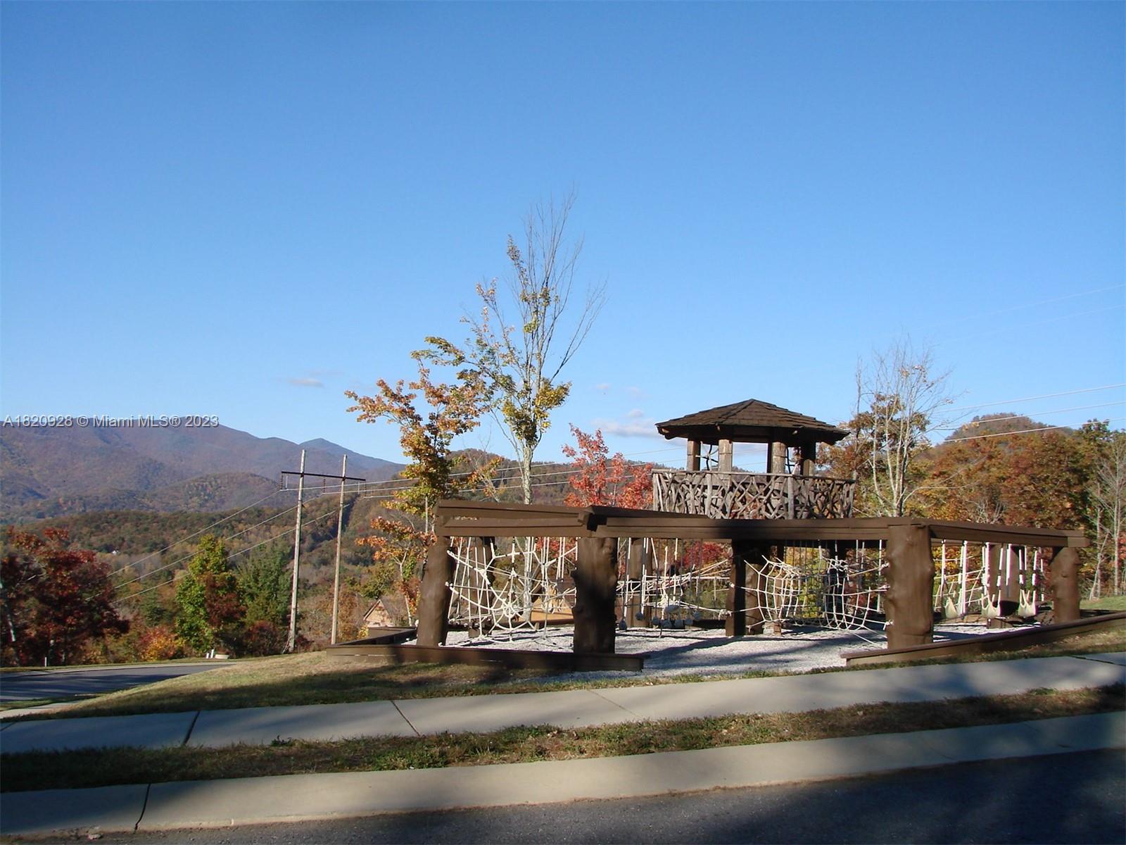 25 Fates Overlook Loop, Unit 103 Black Mountain, NC 28711 - Photo 16 of 21 a view of a street with a cars parked on the road
