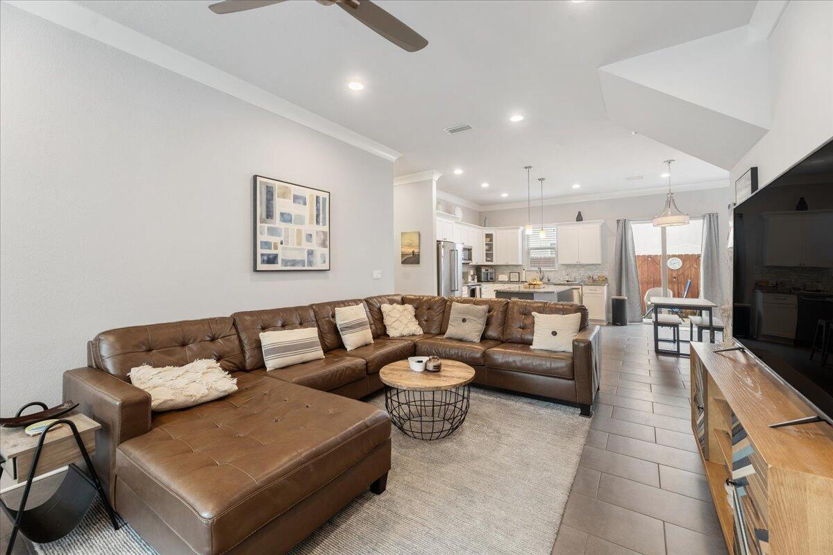 995 Airport Road, Unit 26 Destin, FL 32541 - Photo 8 of 39 a living room with furniture and a flat screen tv