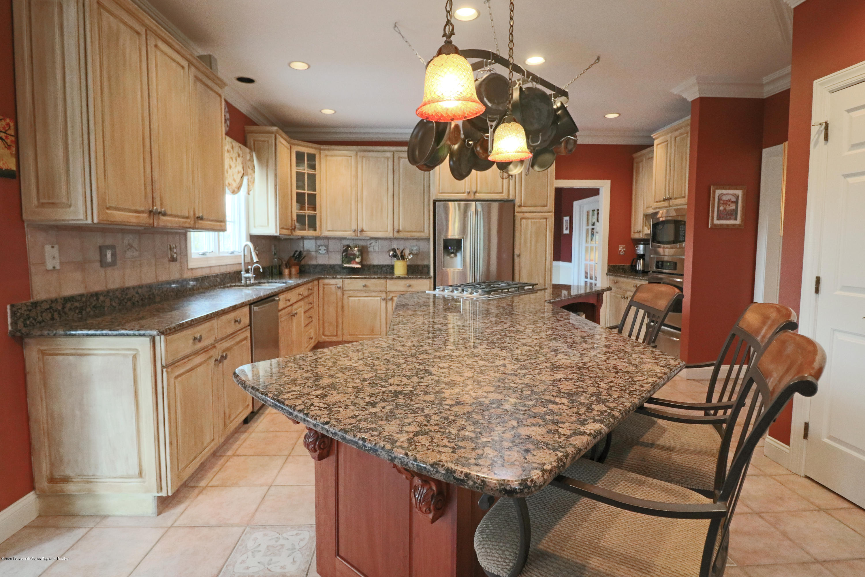 31 Rustic Way Freehold, NJ 07728 - Photo 19 of 62 a kitchen with a table and chairs in it