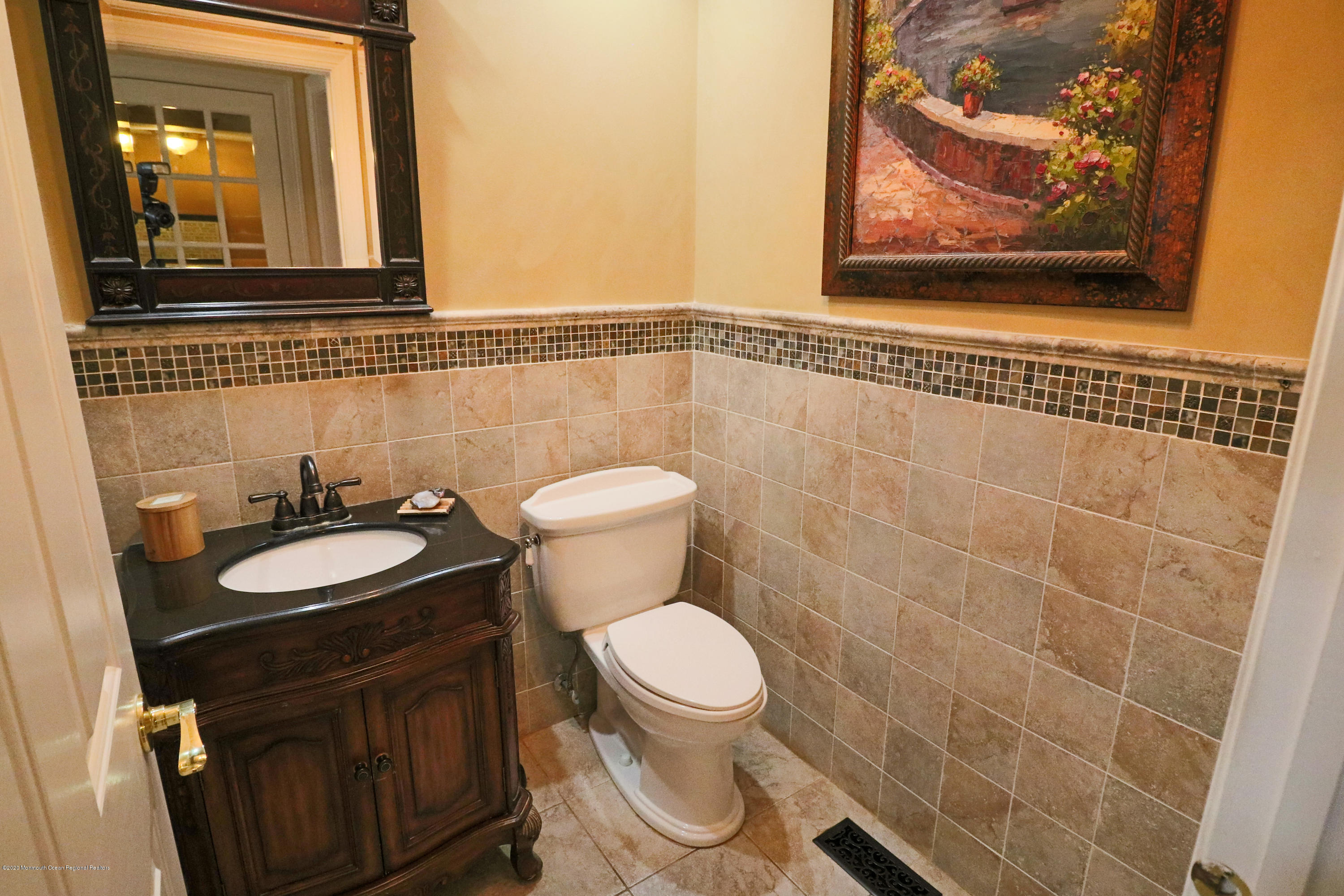 31 Rustic Way Freehold, NJ 07728 - Photo 22 of 62 a bathroom with a toilet a sink and mirror
