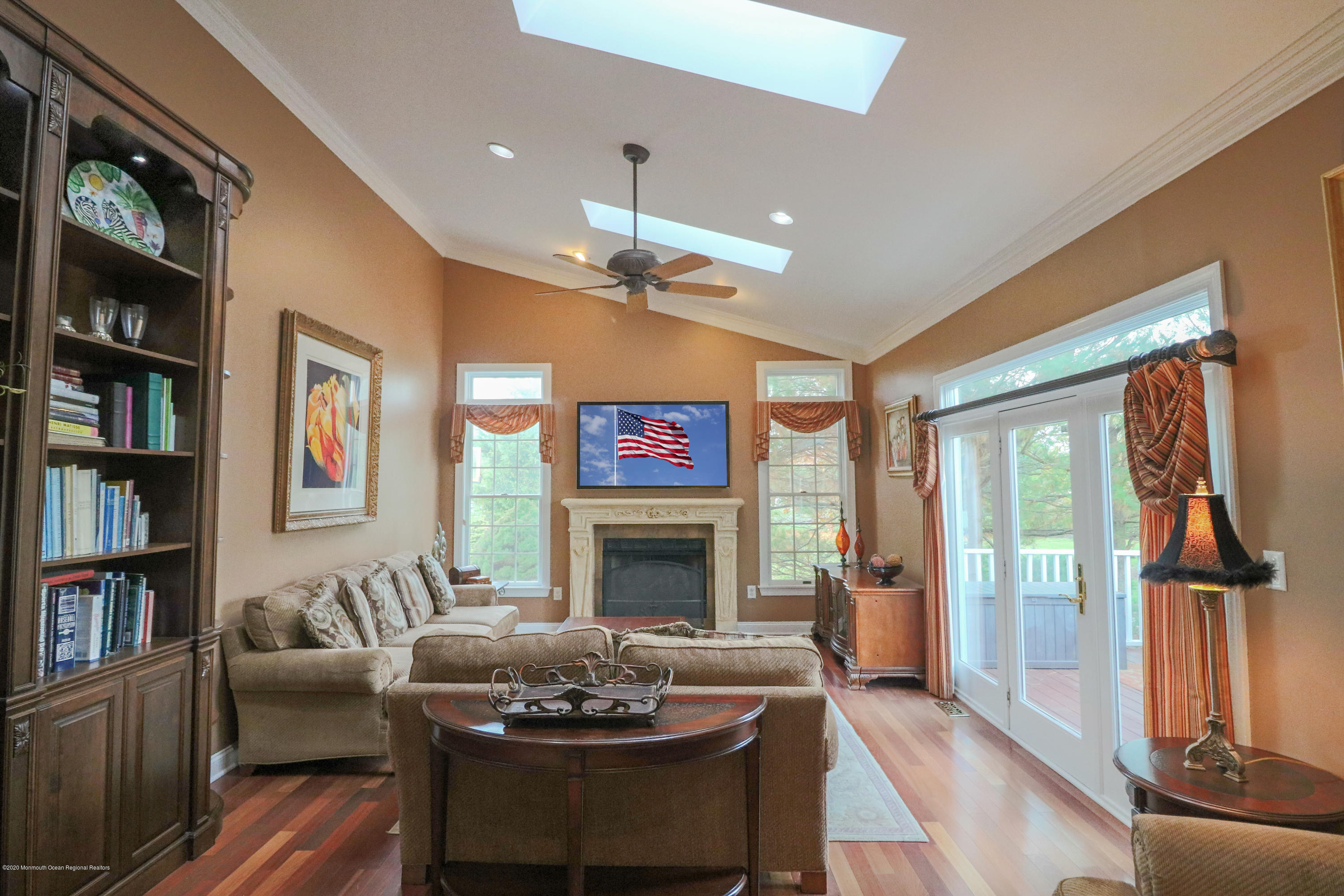 31 Rustic Way Freehold, NJ 07728 - Photo 25 of 62 a living room with furniture fireplace and book shelf