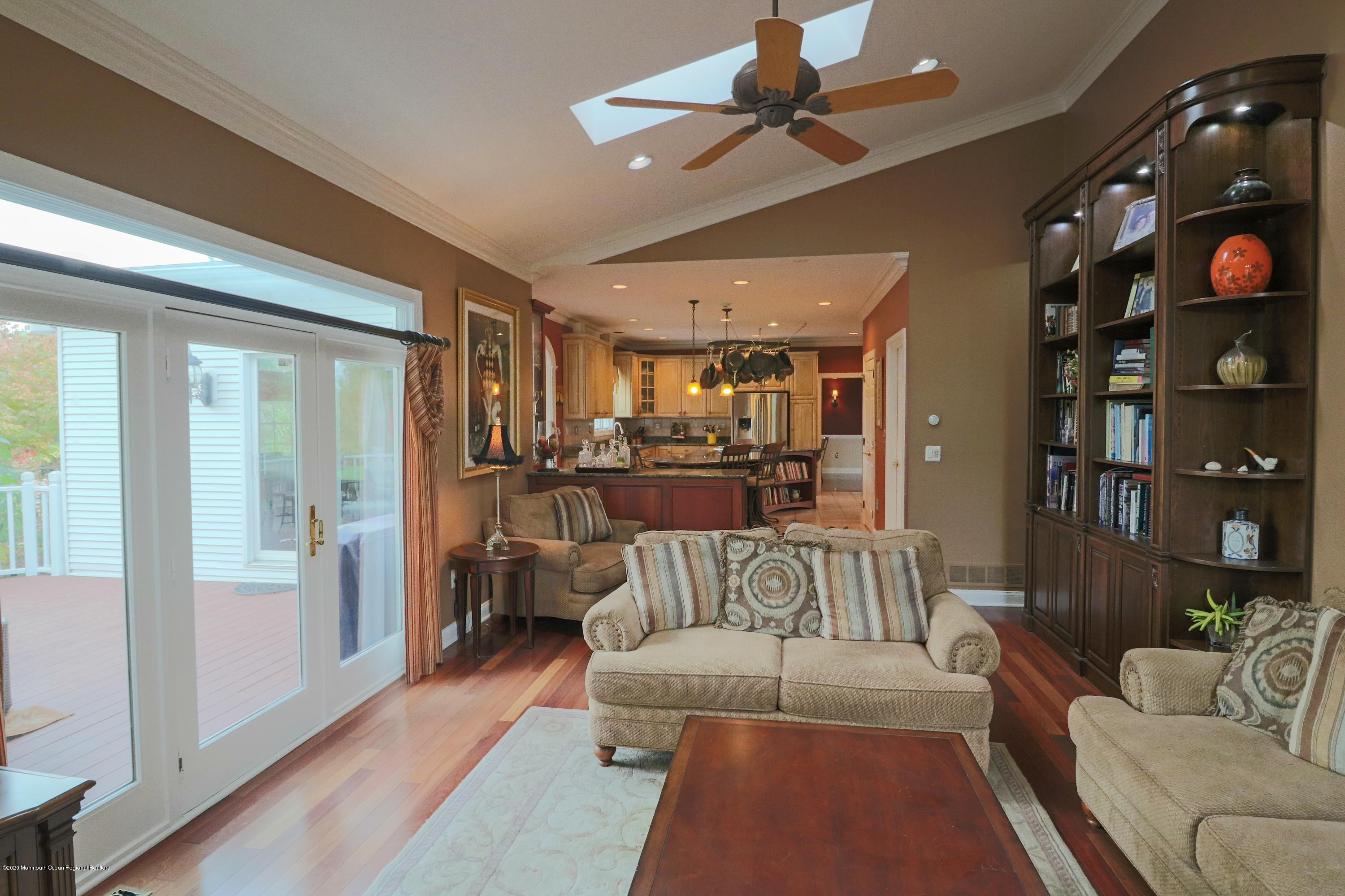 31 Rustic Way Freehold, NJ 07728 - Photo 27 of 62 a living room with furniture a rug and a chandelier