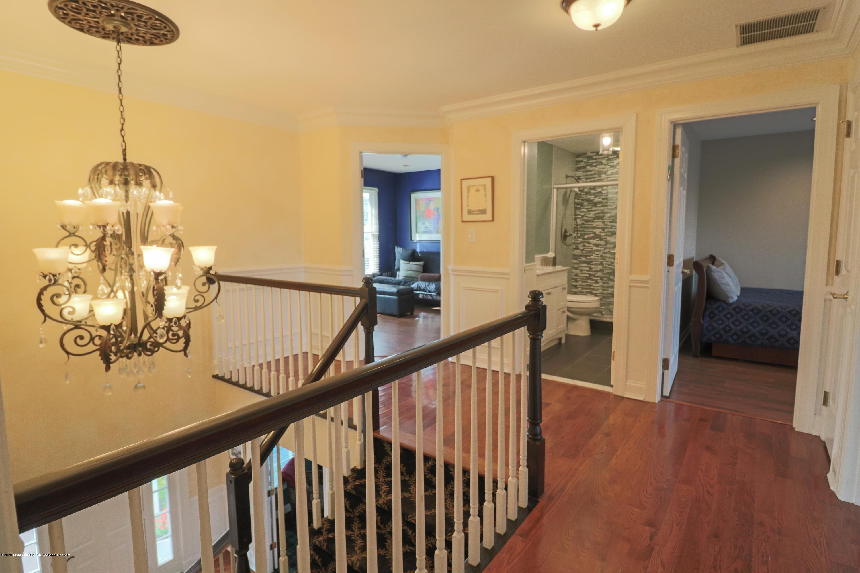 31 Rustic Way Freehold, NJ 07728 - Photo 30 of 62 a view of a hallway with wooden floor and stairs